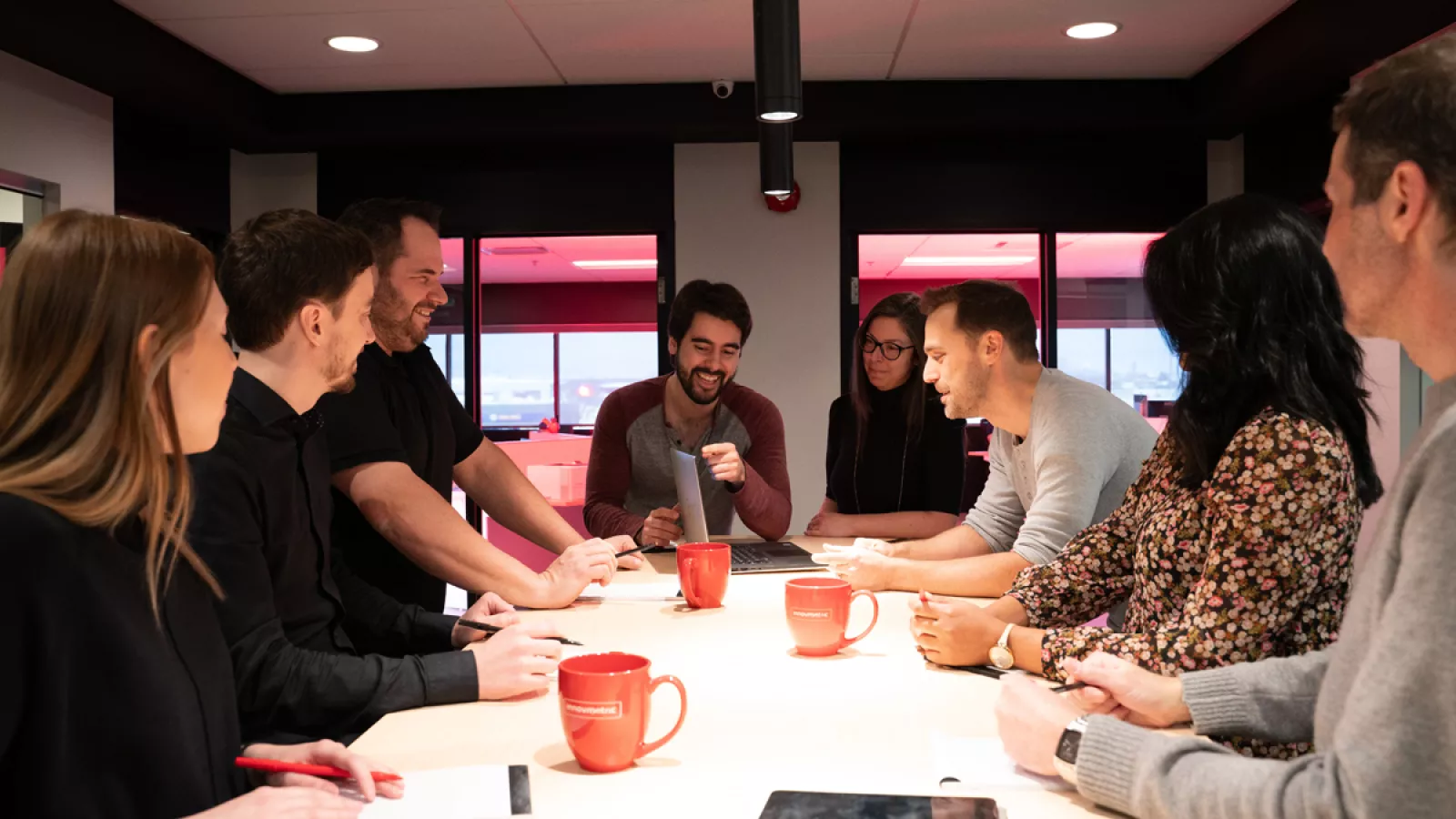 InnovMetric employees discussing at head office in Quebec City, Canada.