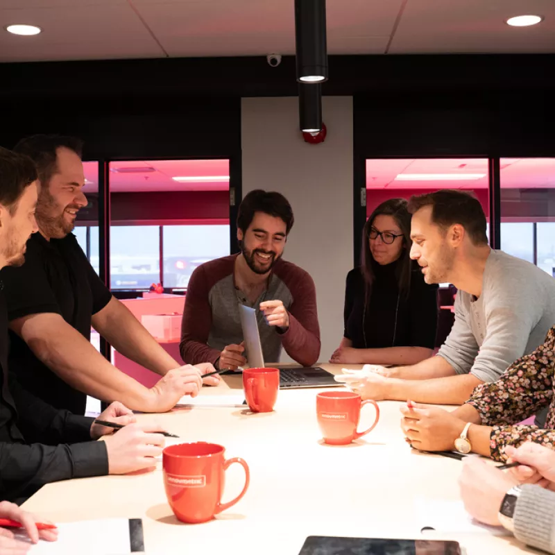 InnovMetric employees discussing at head office in Quebec City, Canada.